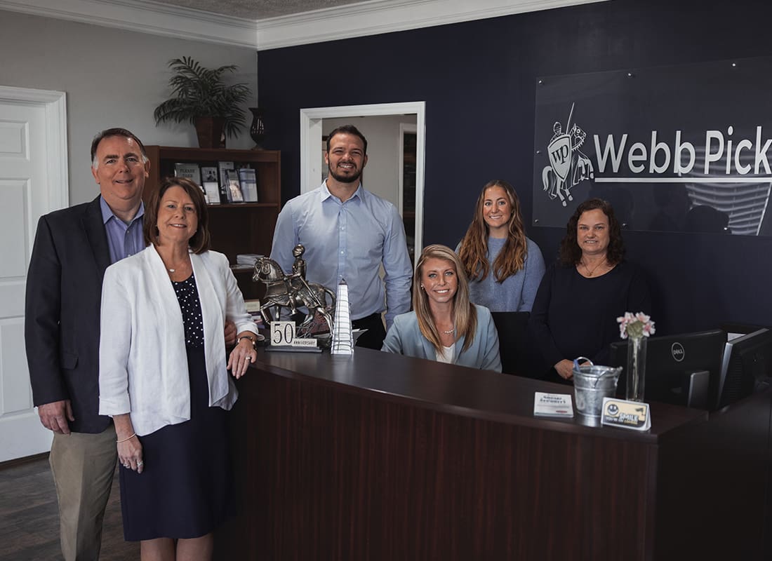 About Our Agency - Webb Pickard Insurance & Investment Services, Inc Team Standing Together in Their Office